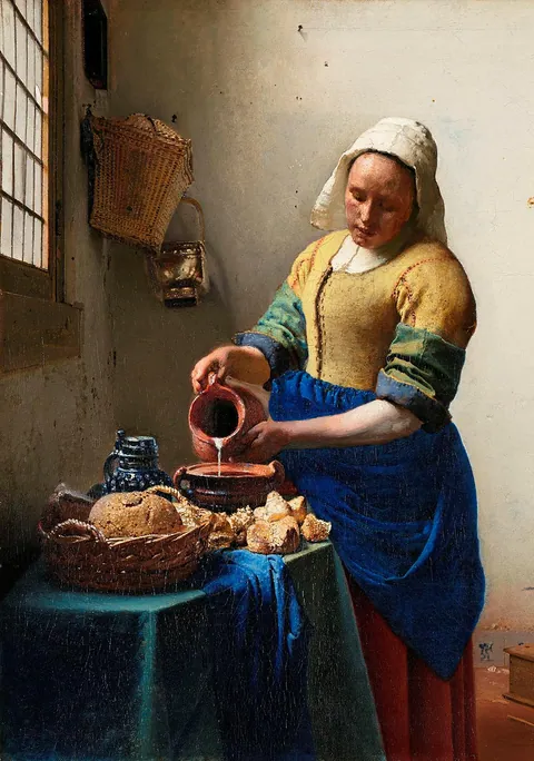 Schilderij Het Melkmeisje van Johannes Vermeer die melk inschenkt bij een venster